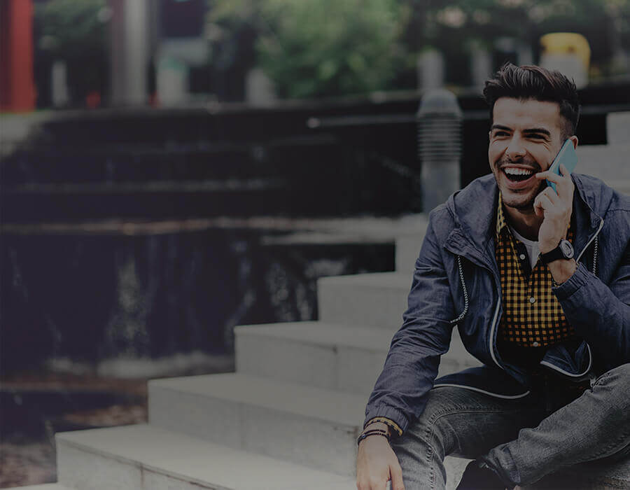 Man Smiling On Mobile