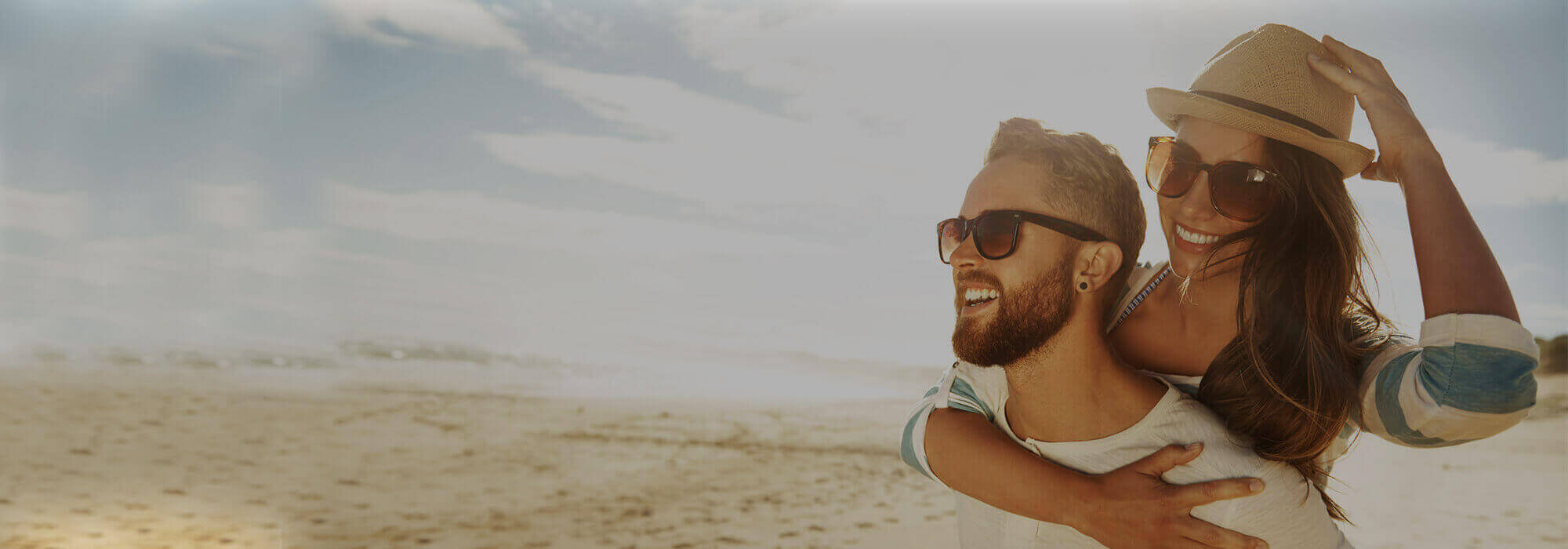 Man and Woman smiling at the beach